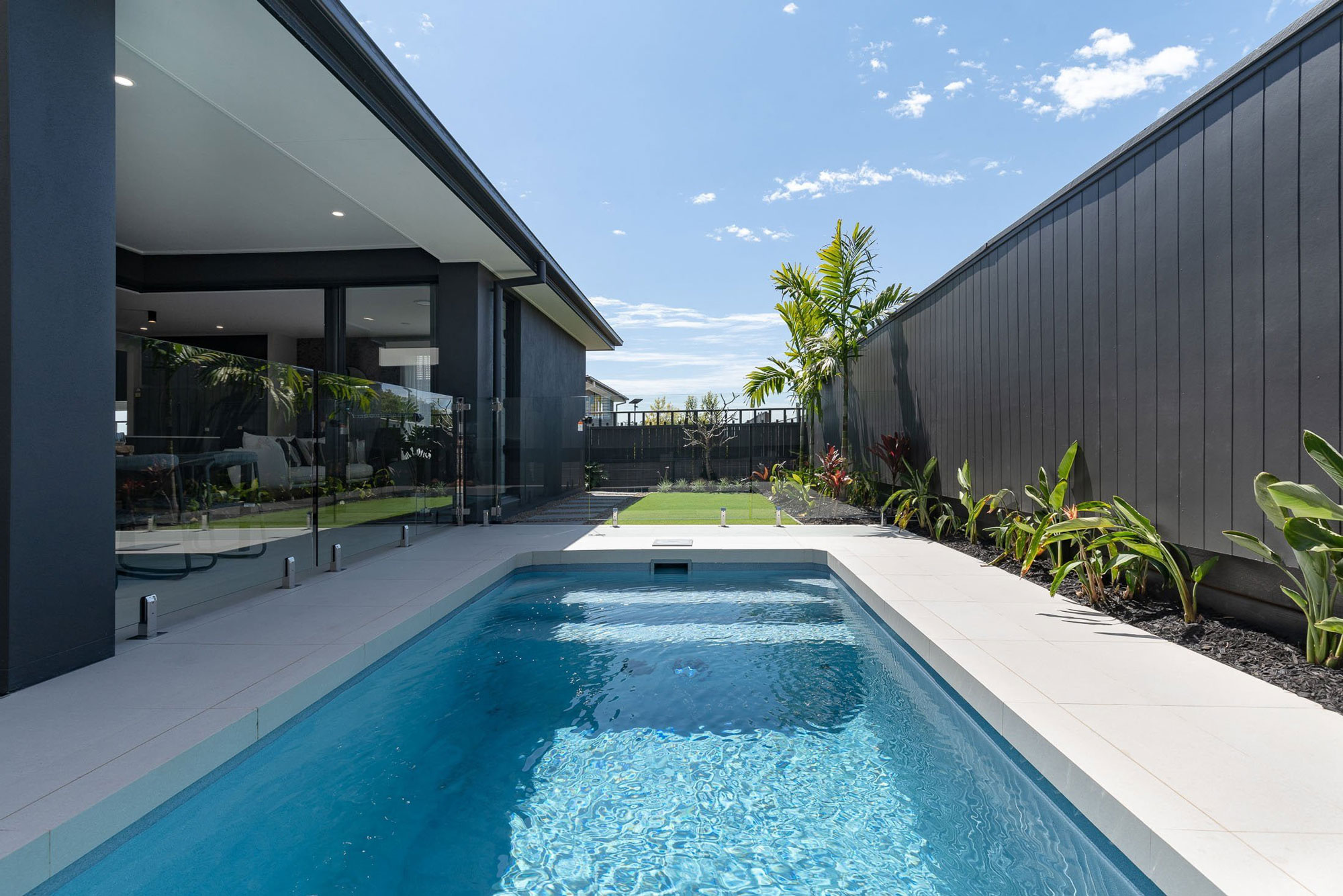 Finished plunge pool with clean patio edges and outdoor seating, showing a compact pool design for Kansas City outdoor living projects.