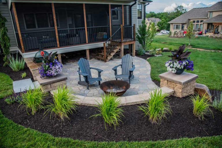 Stone patio, fire bowl, planting beds, and screened porch from the Atlas portfolio